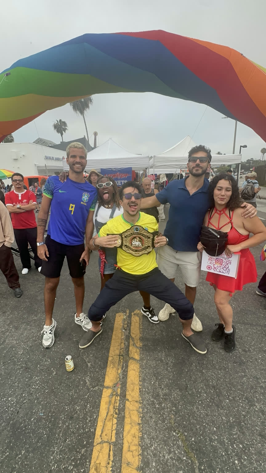 Cock Oil community under the rainbow arch