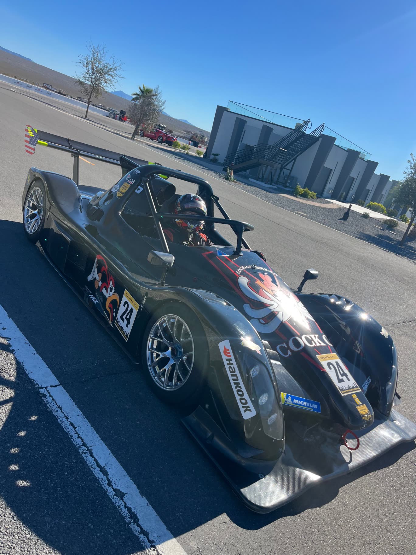 Cock Oil race car side profile at Spring Mountain